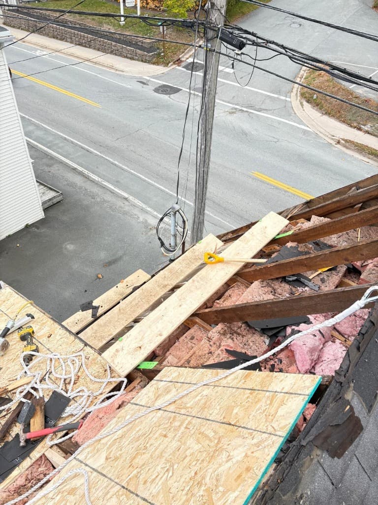Professional roofing repair in progress